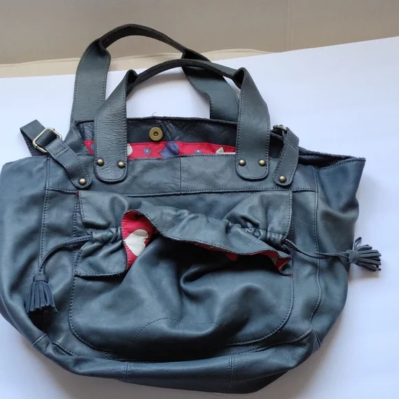 Anthropologie,Lucky Penny, leather purse with heart lining .